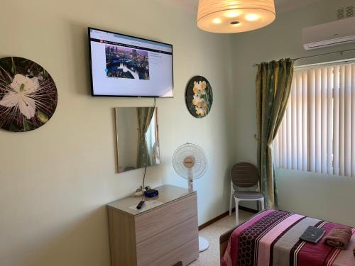 Cloud 9 Residenceにあるテレビまたはエンターテインメントセンター