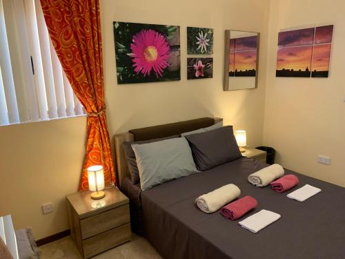 Postel nebo postele na pokoji v ubytování Cloud 9 Residence