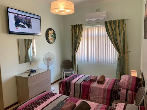 Cloud 9 Residenceにあるテレビまたはエンターテインメントセンター