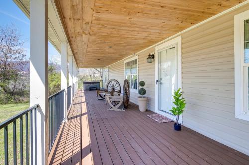a porch of a house with a wooden deck at Private Hot Tub and Mountain View Newport Home in Newport