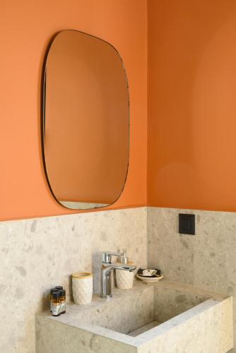 a bathroom with a sink and a mirror at MOD 15 City Centre in Agios Nikolaos
