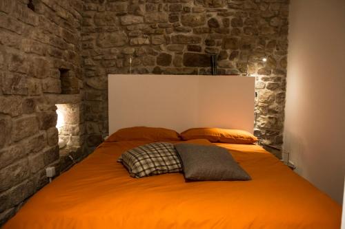 Łóżko lub łóżka w pokoju w obiekcie Residenza La Corte Assisi