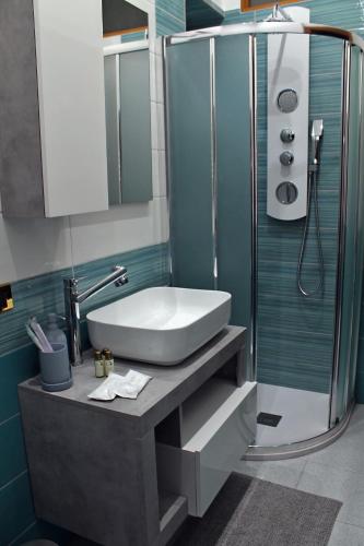 a bathroom with a sink and a shower at Residenza Noè in Antica Villa - Suite & Spa in Fisciano