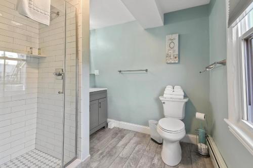 a bathroom with a toilet and a shower at The Inn At Ocean Grove in Ocean Grove