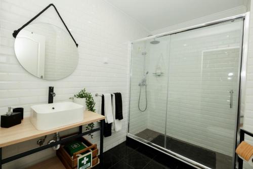 a bathroom with a sink and a shower at NayJay Staycation in Portimão
