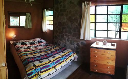 Ένα ή περισσότερα κρεβάτια σε δωμάτιο στο Casas Serranas