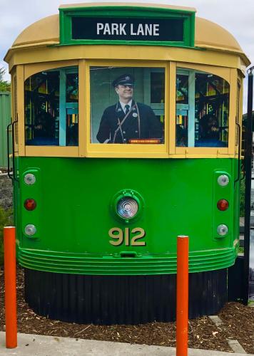 a green trolley with a man sitting in the front at BIG4 Yarra Valley Park Lane Holiday Park in Healesville