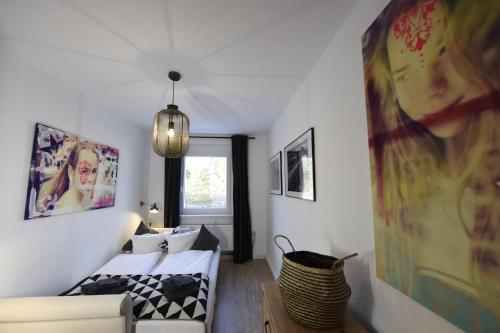 a room with a bed and a couch in it at Oberwiesenthal Apartments in Kurort Oberwiesenthal