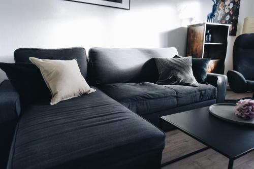 a living room with a couch and a table at Oberwiesenthal Apartments in Kurort Oberwiesenthal