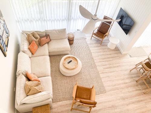 an overhead view of a living room with a couch at The Noosa Apartments in Noosa Heads