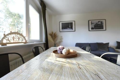 a plate of food on a table in a living room at Oberwiesenthal Apartments in Kurort Oberwiesenthal