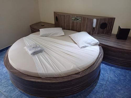 Postel nebo postele na pokoji v ubytování Hotel Fascinação