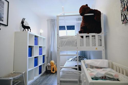 a bedroom with two bunk beds and a bed at Oberwiesenthal Apartments in Kurort Oberwiesenthal
