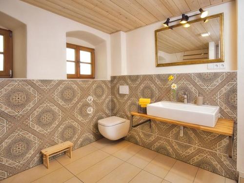 a bathroom with a sink and a toilet at Oberprill Modern retreat in Loitzendorf