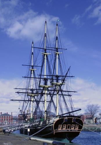 a large boat sitting in the water next to a bridge at Salem Waterfront Hotel & Suites in Salem