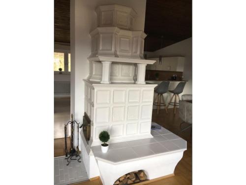 a kitchen with a white cabinet with a plant on it at Villa Alpenblick Comfortable holiday residence in Füssen