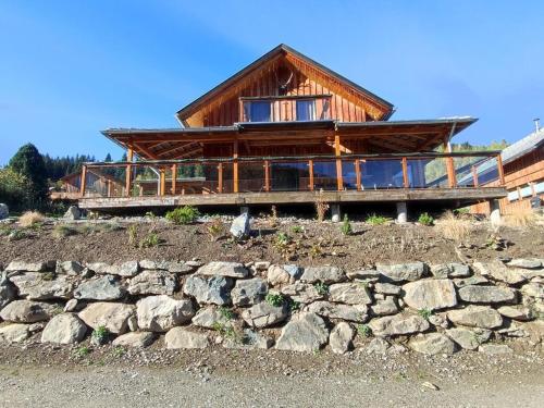 a house on a hill with a stone wall at Alpenglöckchen Comfortable holiday residence in Stadl an der Mur