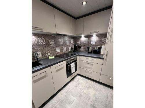 Η κουζίνα ή μικρή κουζίνα στο Chalet St Lambertus Apartment B