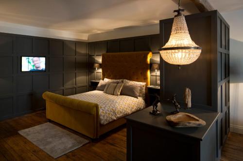 Un pat sau paturi într-o cameră la Cotswold Grey