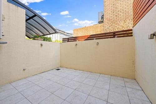 an empty balcony with a view of a building at Comforting 2BR House & FishMarket & Casino-3 mins walk in Sydney