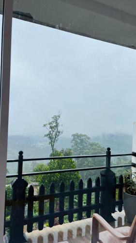 a view from the balcony of a house at Mountain Paradise Bliss Guest House in Haputale