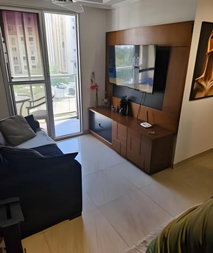 TV a/nebo společenská místnost v ubytování Apart Barra Olimpica Prox Riocentro e FarmasiArena