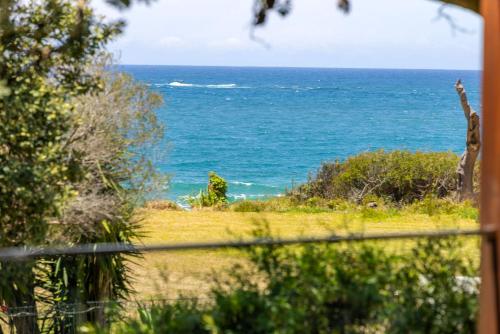 a view of the ocean from a house at Surfspray I Pet Friendly I Absolute Beachfront in Culburra Beach