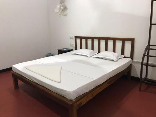 Postel nebo postele na pokoji v ubytování Greenwood Hotel Sigiriya