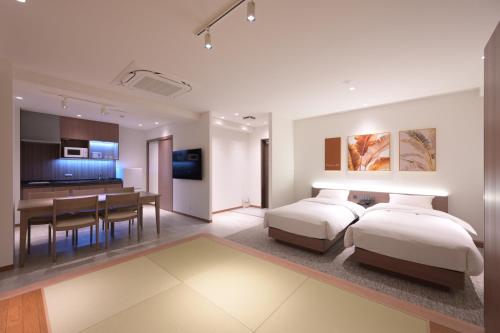 Postel nebo postele na pokoji v ubytování COCOYO Hotel 大塚