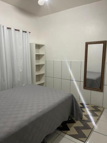 En eller flere senge i et værelse på Ótimo apartamento