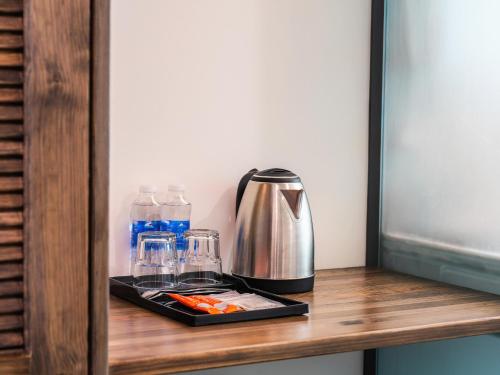 Příslušenství pro přípravu čaje a kávy v ubytování Greenview City Hotel