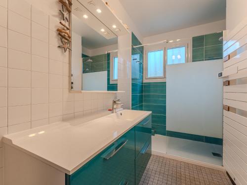 a bathroom with a sink and a mirror at Maison 6 pers, jardin clos, proche plages et commerces - FR-1-521-45 in Biscarrosse-Plage