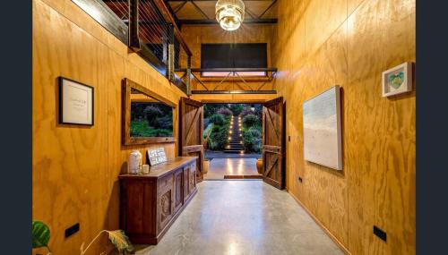 a hallway of a house with wooden walls at Luxury on Lake Tinaroo Lakefront Living in Yungaburra