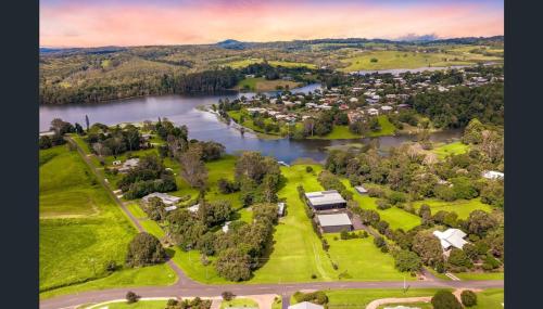 an aerial view of a town next to a river at Luxury on Lake Tinaroo Lakefront Living in Yungaburra