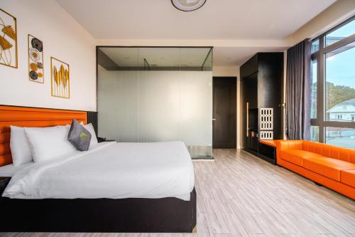 Postel nebo postele na pokoji v ubytování Greenview City Hotel