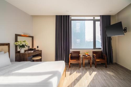 Postel nebo postele na pokoji v ubytování Greenview City Hotel