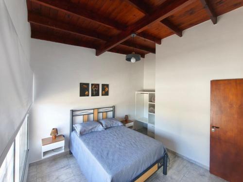 En eller flere senge i et værelse på Departamento Bellamar I