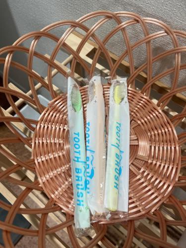a wicker basket with two toothbrushes at 青島オーベルジュ in Miyazaki