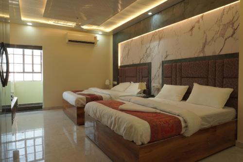 Cama o camas de una habitación en Classy5 Guest House