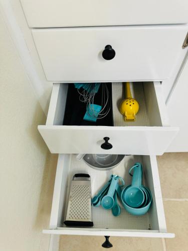 a drawer in a dresser with toys in it at Tranquil Cove Studio Near Mojave Aerospace Airport in Mojave