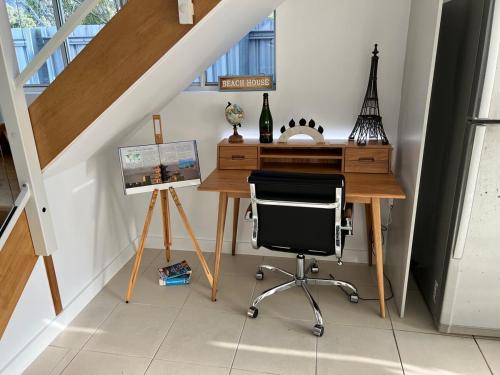 an office with a desk and a chair in a room at Island Romance or Family & Pool in Nelly Bay