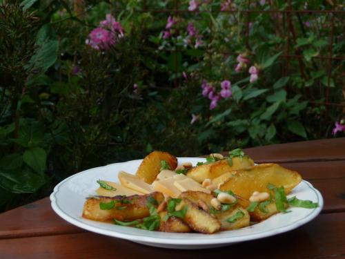 a plate of food on a wooden table at Selatuinen in Appelscha