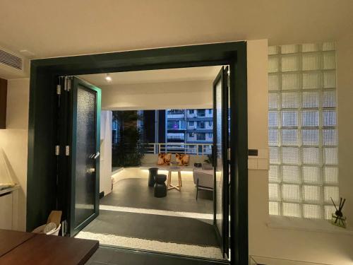 an open door to a living room with a view at Lucky Jili in Chengdu