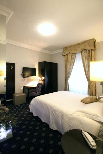 Sangallo Hotelにあるベッド