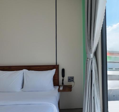 Ένα ή περισσότερα κρεβάτια σε δωμάτιο στο vLuna Can Tho Hotel