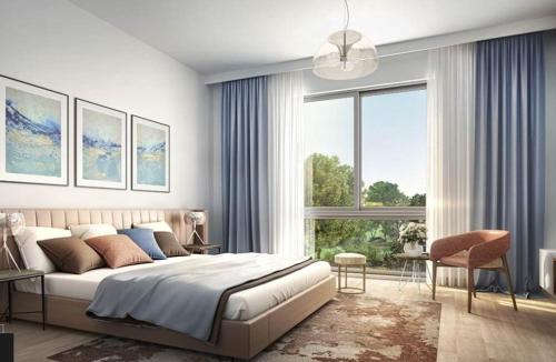 a bedroom with a large bed and a large window at Noya luma, yas island in Yas Island