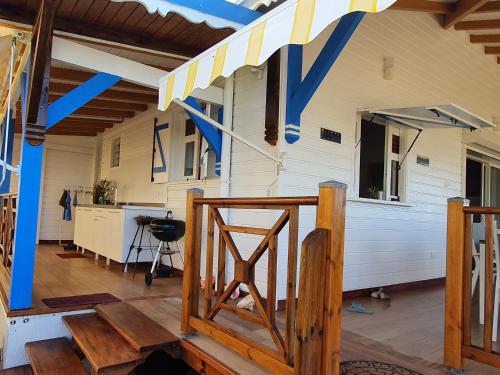 a room with awning on the side of a house at Chambre créole et sa salle de bain chez Michelle in La Désirade