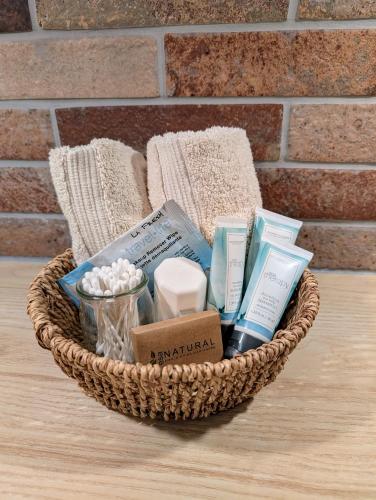 a basket with soap and other items on a table at 4 Mile Creek Cabin (Creekside) in Nelson