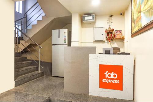 a room with a refrigerator and a staircase at Hotel Star Light - Near Jagtap dairy in Pune