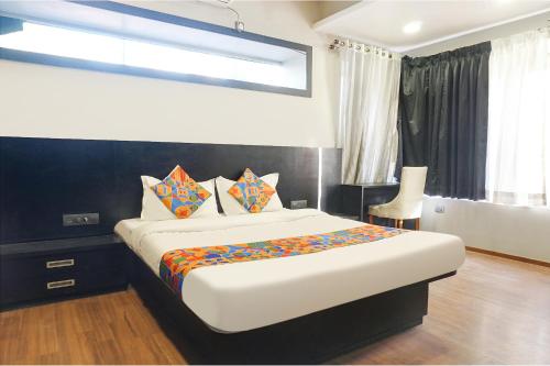 a bedroom with a large bed in a room at Hotel Star Light - Near Jagtap dairy in Pune